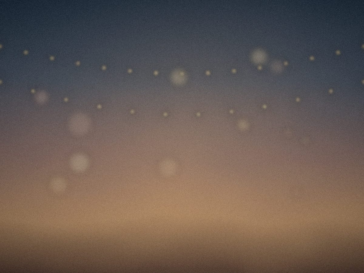String lights over the restaurant terrace at dusk